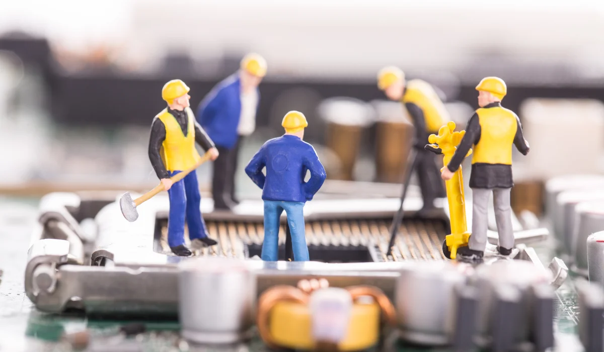 toy engineers repairing machine